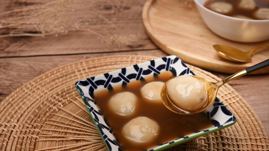 Traditional Chinese sweet dumplings in sweet ginger soup.